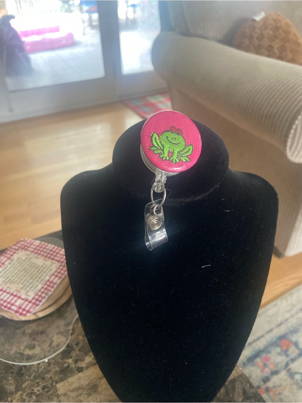 Cute Green Frog Badge Reel on Pink Background